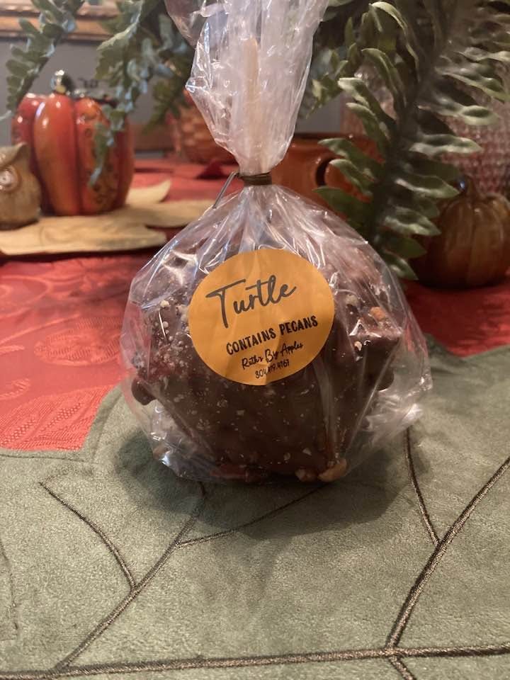 A wrapped Turtle apple with its product label
